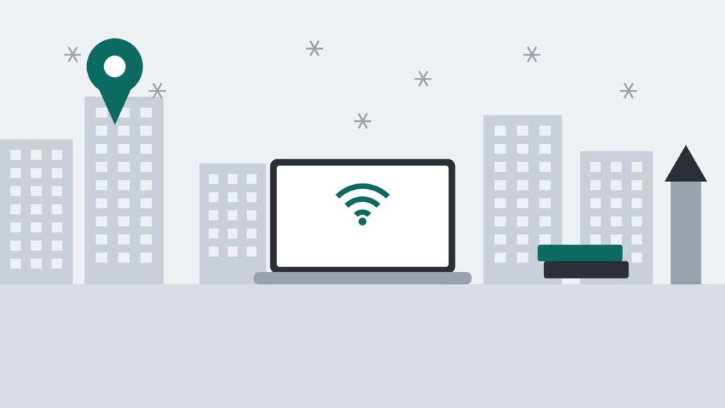 雪の結晶が舞う街並みと時計台風の建物、ノートPC、積んだ本、地図のピンを描いたイラスト